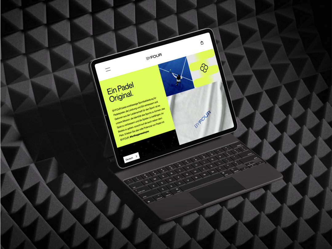 Ipad mockup showing the By Four Landing page in German developed by Can O' Baked Beans.